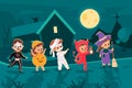 Halloween city. Trick-or-treaters costumed kids walking at night, holiday candy hunt, scary little monsters children Royalty Free Stock Photo