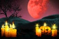 Halloween colorful creepy night backdrop - set of candles on left and candle in pumpkin style on the right, lanterns in the dark Royalty Free Stock Photo