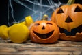 Halloween composition with ceramic Jack Lantern pumpkins and gym dumbbells. Royalty Free Stock Photo