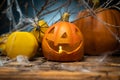 Halloween composition with ceramic Jack Lantern pumpkins and gym dumbbells. Royalty Free Stock Photo