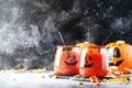 Halloween composition with festive red bloody drink and smiling