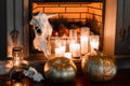 Halloween composition on fireplace closeup.