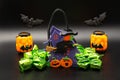 Halloween composition set with Candy Bags Cute Felt Pouches with Handles, Trick or Treat Goody Bags, bats on black background. Royalty Free Stock Photo