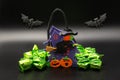Halloween composition set with Candy Bags Cute Felt Pouches with Handles, Trick or Treat Goody Bags, bats on black background. Royalty Free Stock Photo