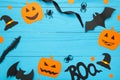 Halloween composition with spiders and bats on blue background. View from above Royalty Free Stock Photo