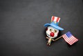 Halloween concept background of funny bozo wooden ghost with American flag