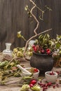 Halloween concept background. Witch bowler, mistletoe, elderberry. Dry herbs, flowers, fresh berries