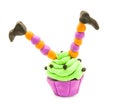 Fake clay cupcake halloween craft with witch legs isolated on white with clipping path