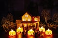 Halloween concept of creepy ghosts and pumpkins dancing on a yard