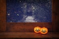 Halloween concept. Cute pumpkins on wooden window sill Royalty Free Stock Photo