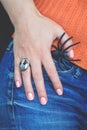 Halloween female hand with spider and skull ring