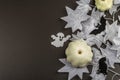 Halloween concept. Ghostly white maple leaves on a branch, pumpkins Royalty Free Stock Photo