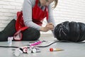 A woman artist prepares for halloween and paints pumpkins Royalty Free Stock Photo