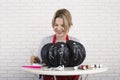 A woman artist prepares for halloween and paints pumpkins Royalty Free Stock Photo