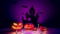 Halloween concept pumpkins and purple-toned background with bats, 3d rendering