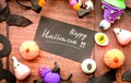 Halloween symbols and decorations on wooden table flat lay top view Royalty Free Stock Photo