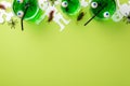 Halloween concept. Top view photo of glasses with green floating eyes punch straws skeleton silhouettes spiders centipedes and Royalty Free Stock Photo