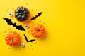 Halloween concept. Top view photo of pumpkins bat silhouettes spooky eyes and confetti on isolated yellow background