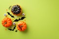 Halloween concept. Top view photo of pumpkins bat silhouettes spooky eyes spiders centipede and ghost silhouettes confetti on