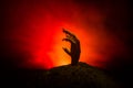 Halloween concept, zombie hand rising out from the ground or zombie hand coming out of his grave Royalty Free Stock Photo
