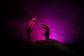 Halloween concept, zombie hand rising out from the ground or zombie hand coming out of his grave Royalty Free Stock Photo