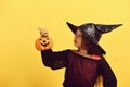 Halloween and costume party concept. Girl with carved orange pumpkin Royalty Free Stock Photo