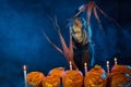 Halloween costume woman, tree girl with pumpkins