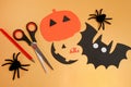 Halloween craft for kids. Materials for creativity of orange, and black colors. Children\'s master class