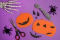 Halloween craft for kids. Materials for creativity on purple background. Children\'s master class