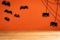 Halloween crafts, bat, spider and cobweb on orange background