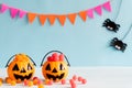 Halloween crafts, orange pumpkin with colorful jelly on wooden table