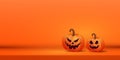Halloween creative banner with two orange scary pumpkins on purple background. Place for text. Vector illustration. Royalty Free Stock Photo
