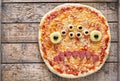 Halloween creative scary food monster zombie face with eyes pizza snack Royalty Free Stock Photo