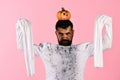 Halloween, culture and traditions concept. Guy with beard holds pumpkin Royalty Free Stock Photo