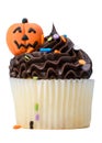 Halloween Cupcake. Candy pumpkin Jack-o-lantern frosting or Icing on Top. White isolated background. Royalty Free Stock Photo