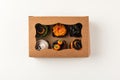 top view of delicious decorative halloween cupcakes in box