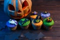 Halloween cupcakes with colored decorations: pumpkin, ghost, spi Royalty Free Stock Photo