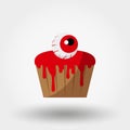 Halloween cupcakes with an eye and bloody icing Royalty Free Stock Photo