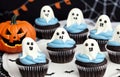 Halloween cupcakes with ghost and pumpkin on top, closeup Royalty Free Stock Photo