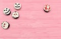 Halloween cupcakes. Mummy and jack-head bloody cupcake. Halloween treats on pink wood background. Royalty Free Stock Photo