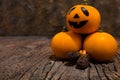 Halloween dark card. Three orange pumpkins with mend. One of them is Jack