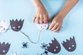 Halloween decorarion. Concept DIY and children creativity. Step-by-step instructions: making garland of ghosts from white and