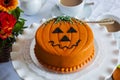 Halloween decorated cake served on ceramic plate. Royalty Free Stock Photo