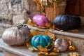 Halloween decorated front door with various color and shape pumpkins Royalty Free Stock Photo