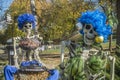 Two Halloween skeletons having fun