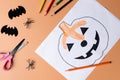 Halloween decoration with stationery on orange color background