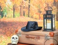 Halloween decorations in a autumn garden. Happy Halloween travelers postcard