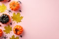 Halloween decorations concept. Top view photo of pumpkins gold glitter leaves spiders and centipede on isolated pastel pink