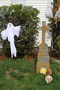 Halloween decorations, gravestone with cross, ghost, skull head