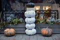 Halloween design home. Street decoration thanksgiving. Cozy scary porch of the house with orange and white pumpkins in fall time. Royalty Free Stock Photo